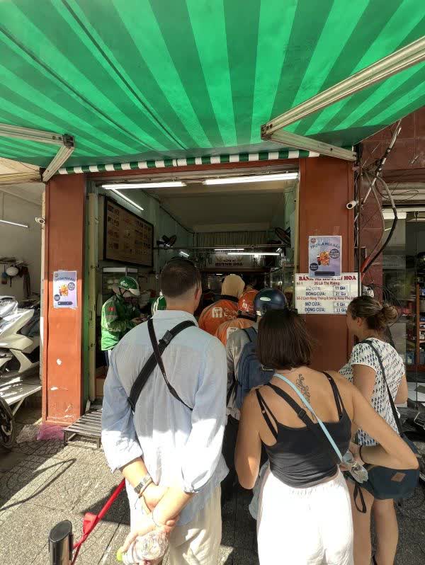 In Line at the Popular Banh Mi Huynh Hoa in District 1, Ho Chi Minh City