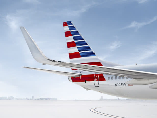 This image shows the tail of an American Airlines airplane on the ground.