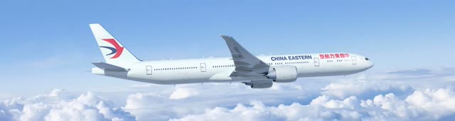 This image shows a Boeing 777-300ER in flight for China Eastern Airlines.