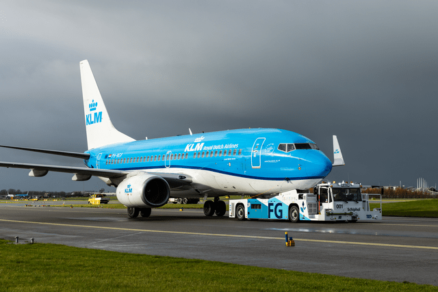 This picture shows a Boeing 737-800 operating for KLM Royal Dutch Airlines at Schiphol Airport.