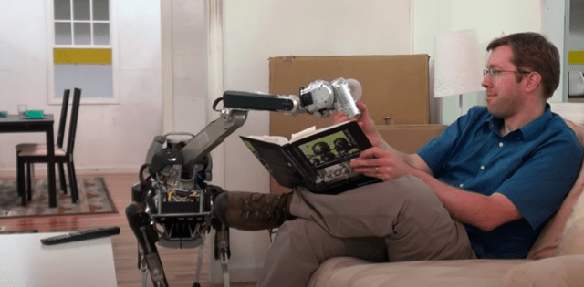 Spot, the robot, handing someone a cold one.