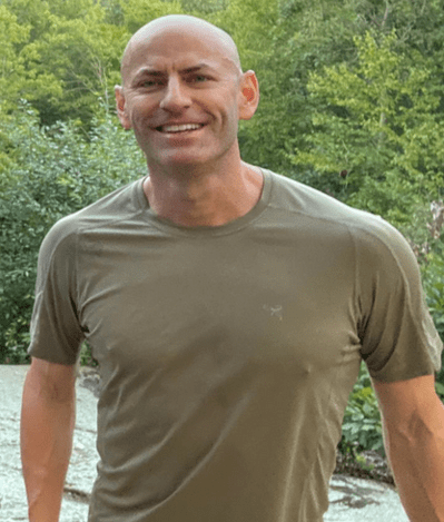 A person smiling for a picture Description automatically generated