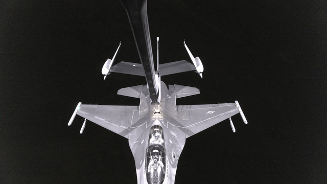 A KC-46 Pegasus refuels an F-16 at night, as seen through the updated version of the Remote Vision System, or RVS 2.0.