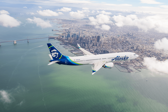 This image shows a Boeing 737 MAX airplane in Alaska Airlines colors