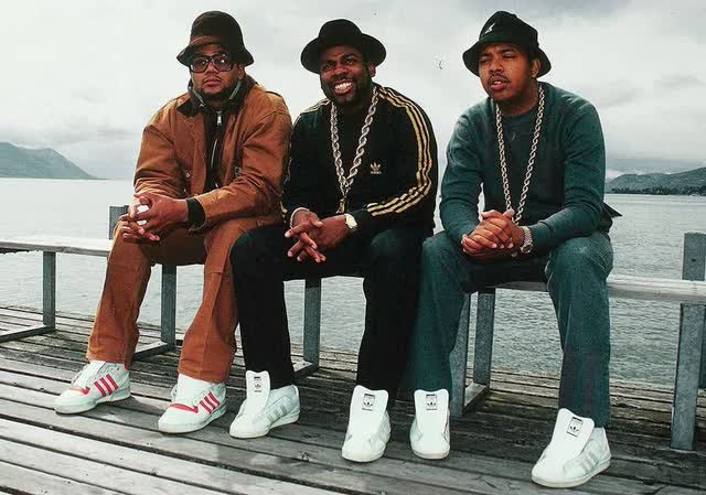 RunDMC wearing Adidas Superstar sneakers without laces: