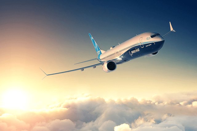 This image shows a Boeing 737 MAX 9 commercial airplane in the skies.
