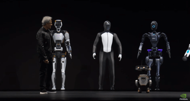 A person standing next to a group of robots Description automatically generated