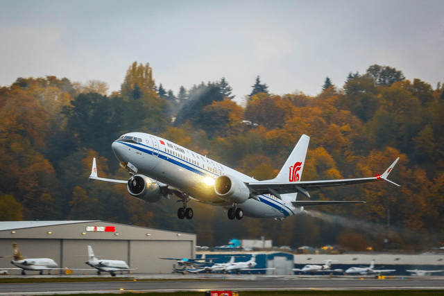 This image shows a Boeing 737 MAX airplane taking off for its delivery flight to China.