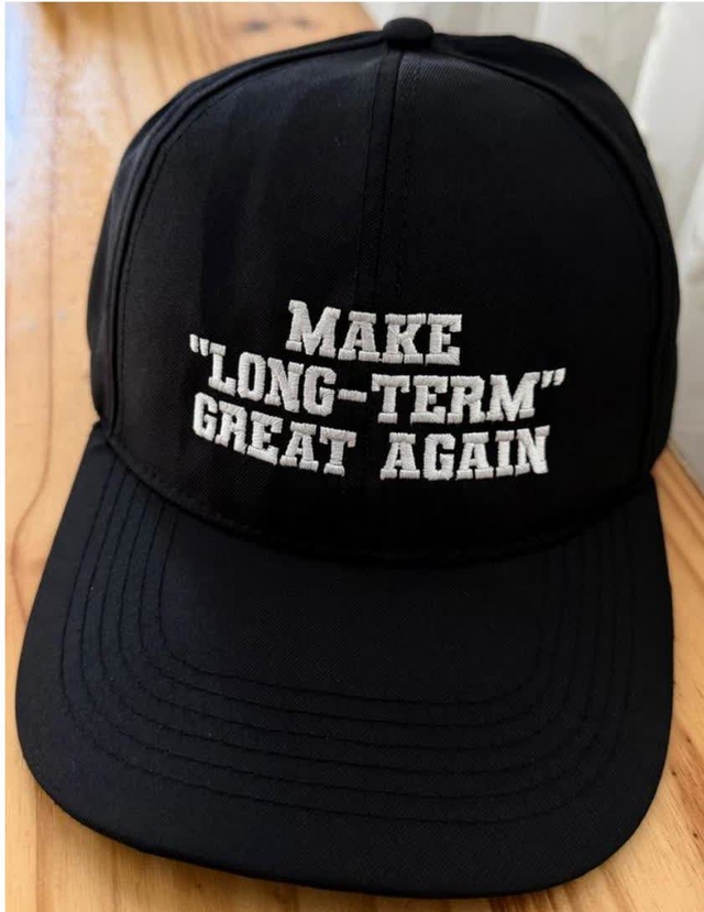 A black baseball cap with the slogan 'MAKE